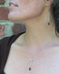 sterling silver hammered teardrop pendant with garnet briolette drop inside